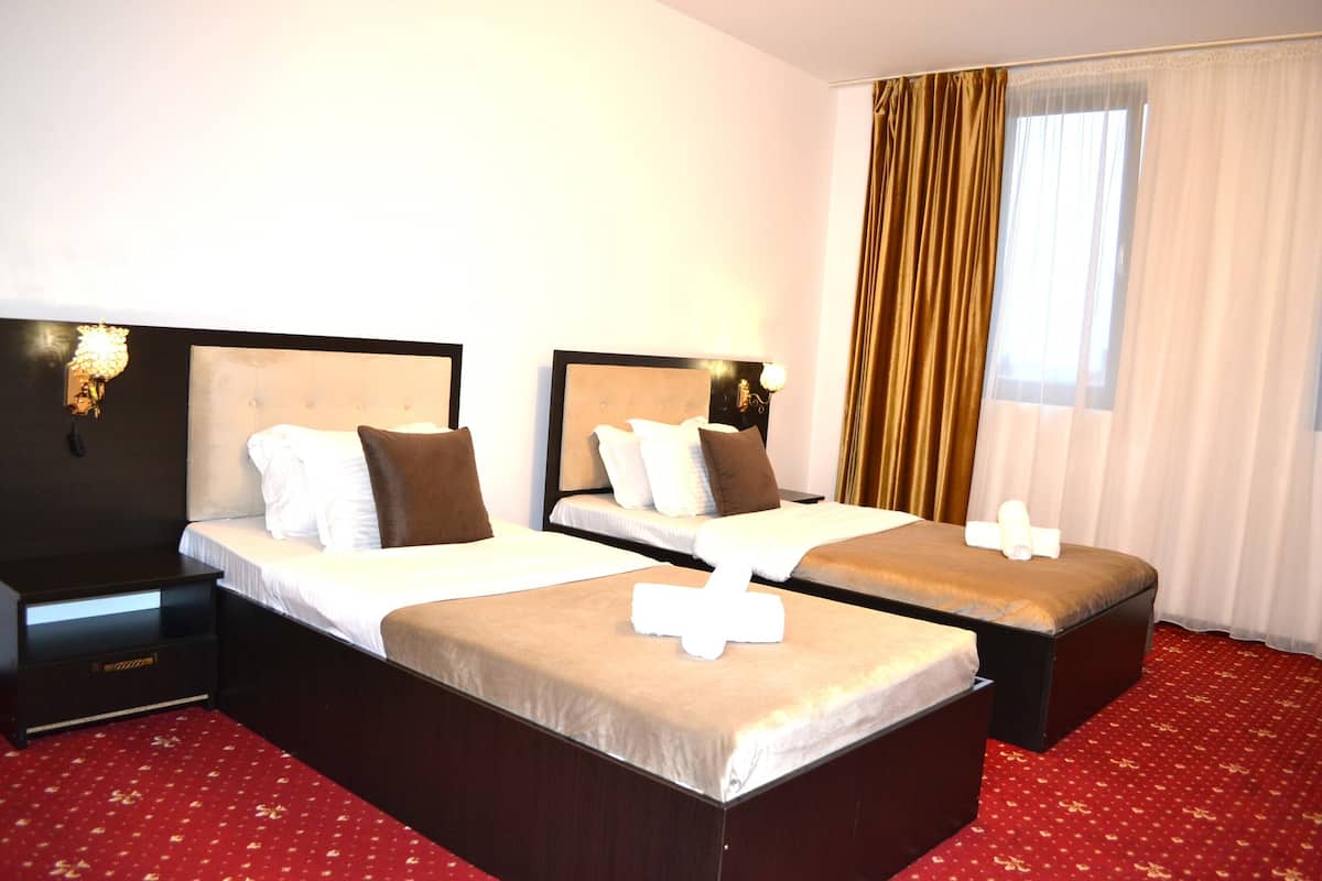Premium bedding, desk, laptop workspace, iron/ironing board