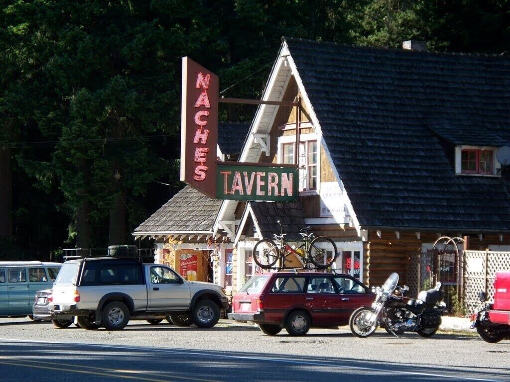 A building with a sign that reads "NACHES TAVERN".