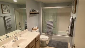 Combined shower/tub, hair dryer, towels, soap