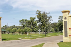 A gated entrance with a sign reading "Riverside." - The City Pads: conveniently located, with everything just a short walk away. (Grand Forks)