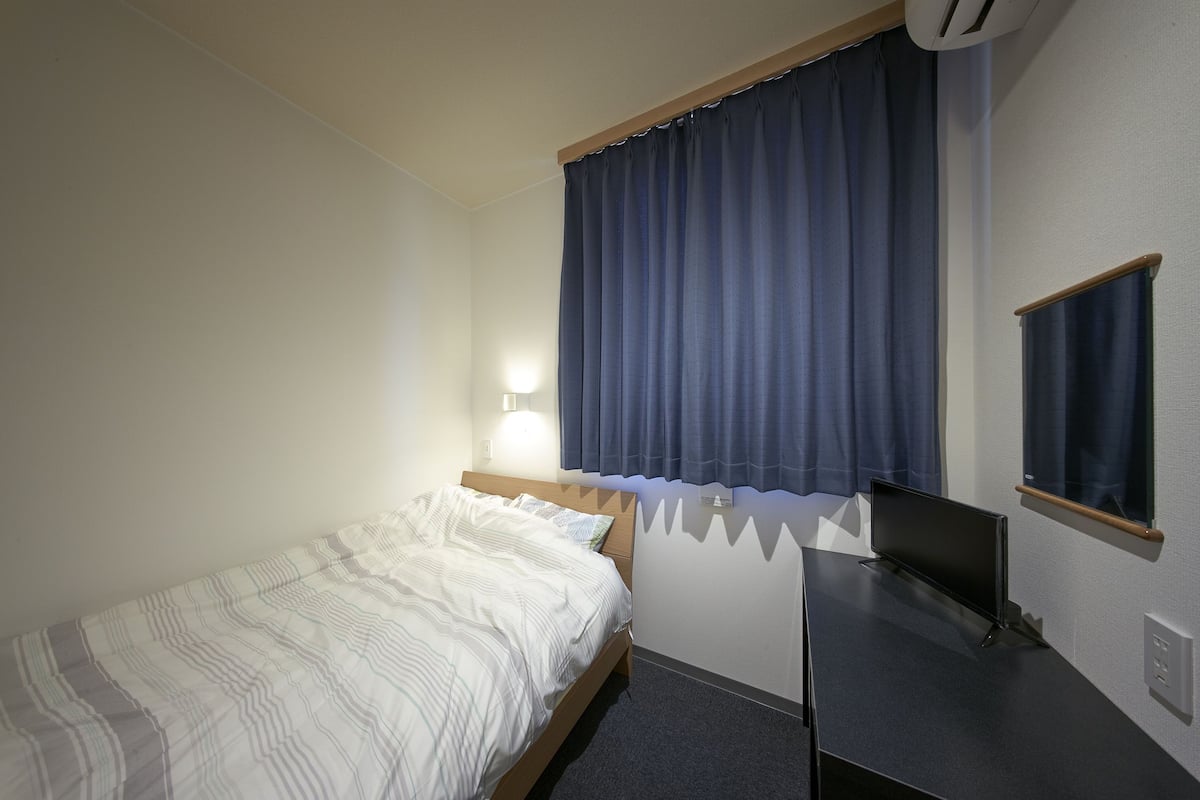 Desk, laptop workspace, blackout curtains, free WiFi