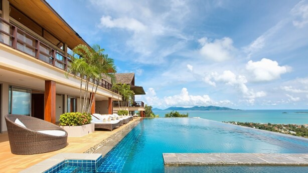 A modern resort with a infinity pool, lounge chairs, and a view of the ocean. - Grand Vista - 3 Bed, Sleep 6 (Ko Samui)