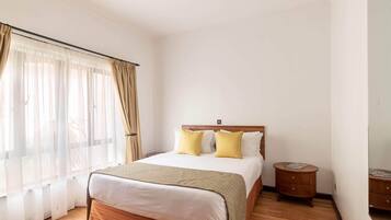 Coffres-forts dans les chambres, fer et planche Ă repasser