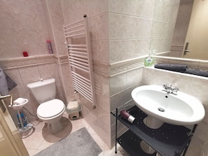 Bathtub, hair dryer, towels, soap