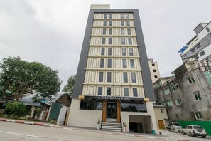 A modern hotel building with a sign reading "The Gandamar Hotel." - The Gandamar Hotel (Yangon)