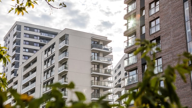 A multi-story residential building with balconies and large windows. - Silver Apartments - ul. Klopot (Warsaw)