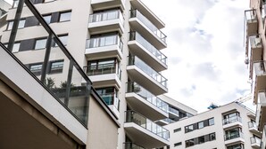 A multi-story residential building with balconies and large windows. - Silver Apartments - ul. Klopot (Warsaw)