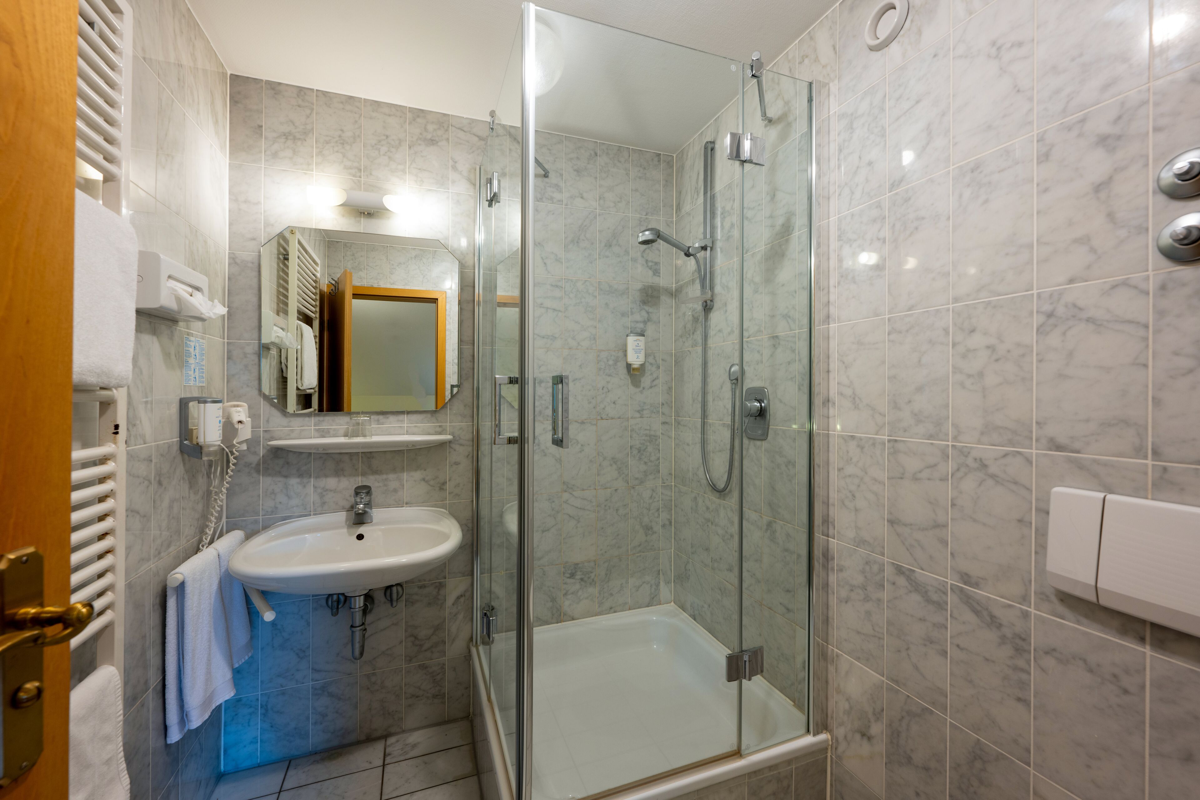 hair dryer, towels, soap, shampoo