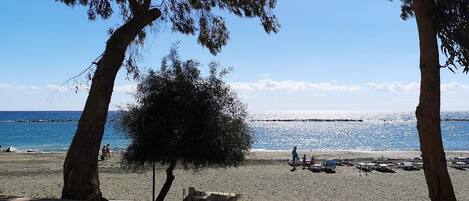 On the beach, sun loungers, beach towels
