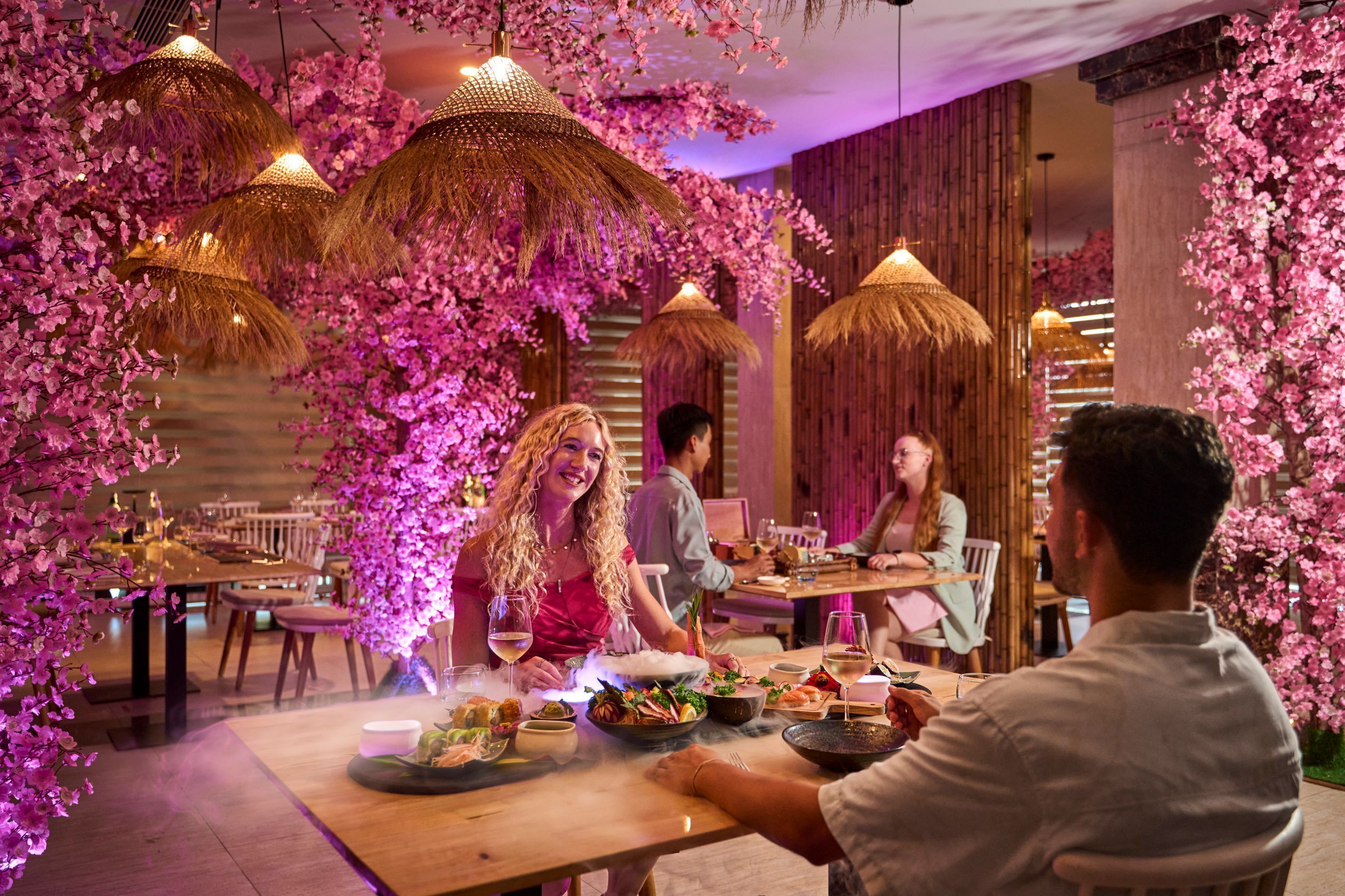 A restaurant with tables, chairs, and a dining area.