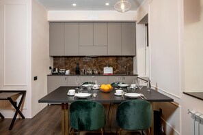 Deluxe Apartment | Private kitchen | Fridge, microwave, stovetop, espresso maker - De Paris Apartments (Kyiv)