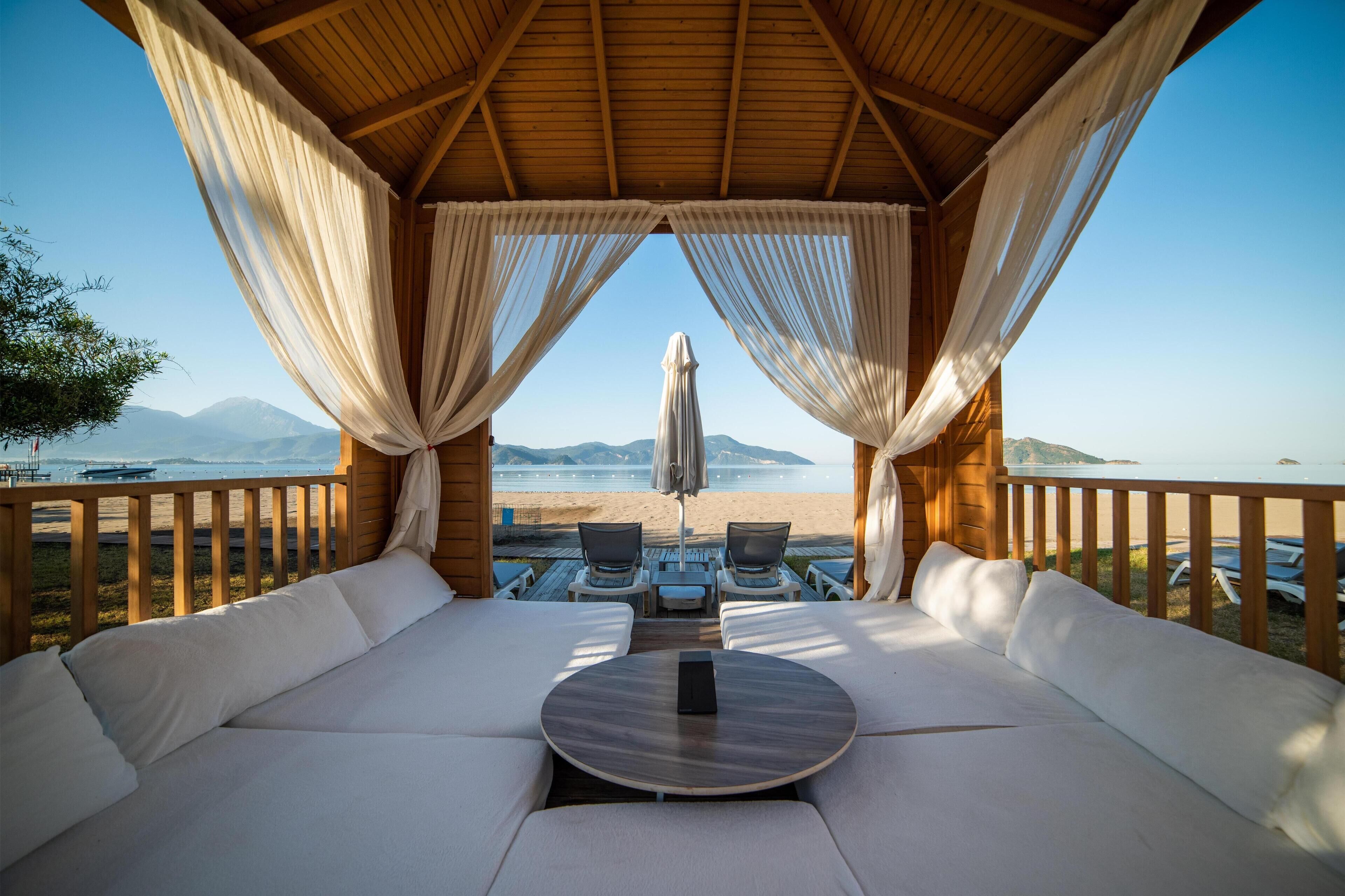 On the beach, sun-loungers, beach umbrellas, beach towels