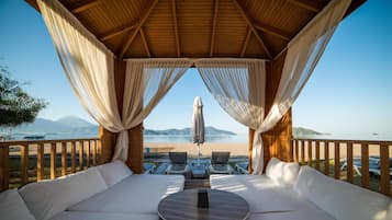On the beach, sun-loungers, beach umbrellas, beach towels