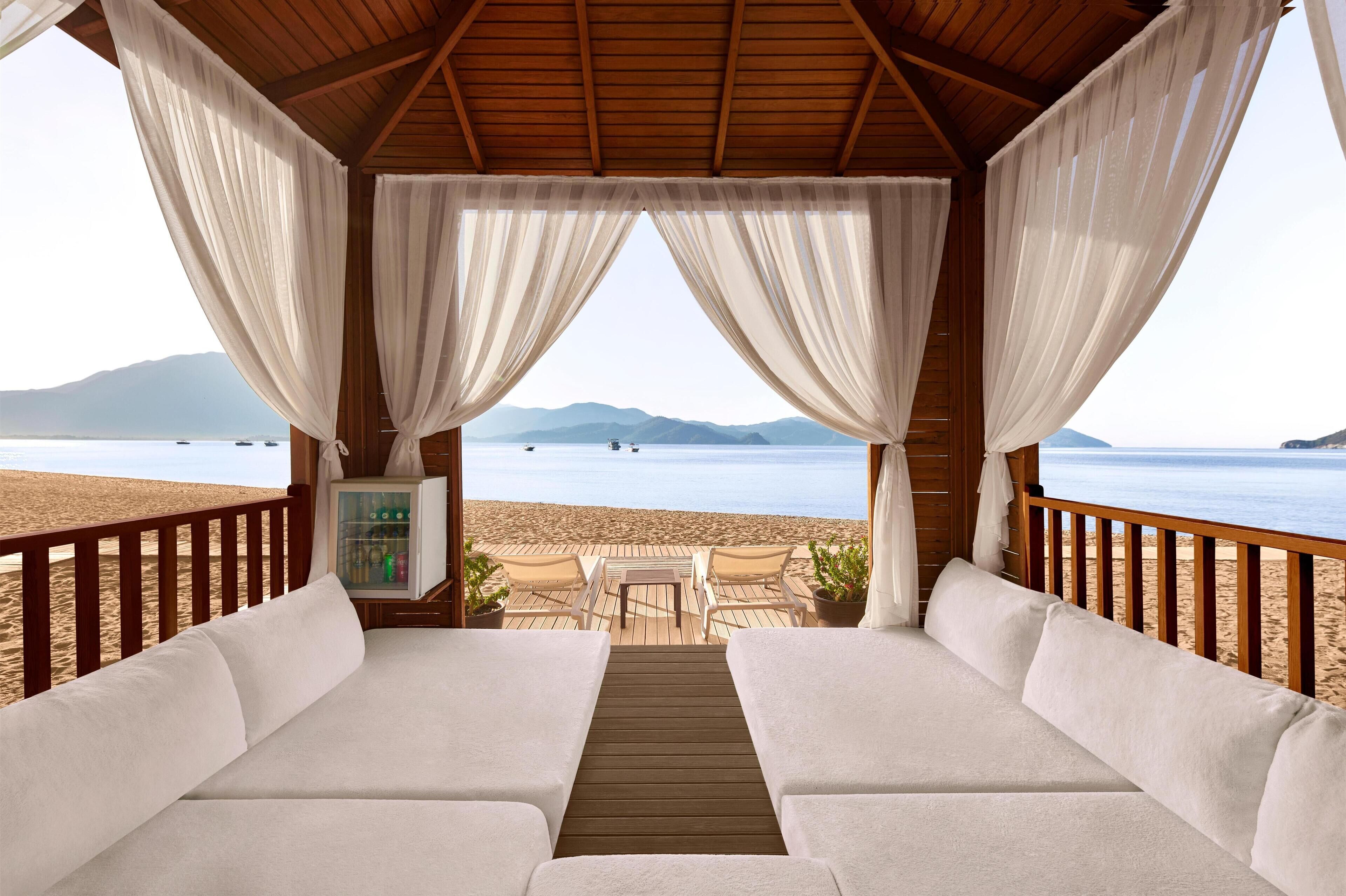 On the beach, sun loungers, beach umbrellas, beach towels