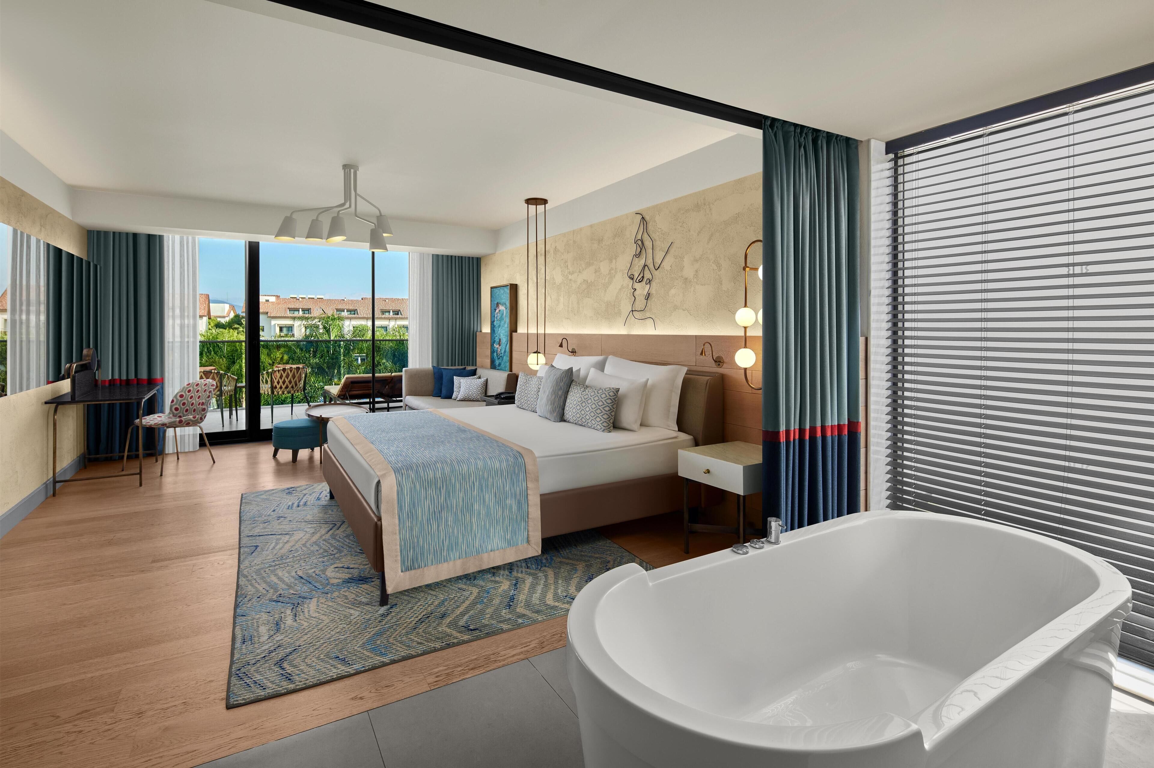 Suite Junior | Minibar con snack e bevande gratuite, una cassaforte in camera