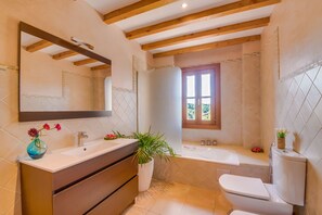 Bathtub, hair dryer, towels