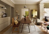 A dining area with a wooden table, white chairs, a bench, and a vase.