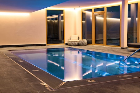Indoor pool, open 9:00 AM to 9:00 PM, pool loungers