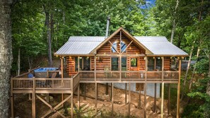 A cabin with a deck, a hot tub, and a chimney. - Lil' Slice of Heaven- Pet Friendly | Hot Tub | Fire Pit | Cherry Log (Cherry Log)