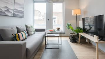 Design appartement | Woonkamer | Een flatscreentelevisie