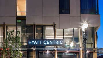 The exterior of the Hyatt Centric hotel with a modern design, large glass windows, and a prominent sign.