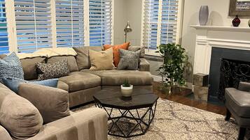 Smart TV, fireplace, books, offices