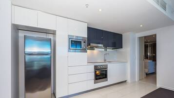 One Bedroom Apartment | Private kitchen | Fridge, microwave, oven, stovetop