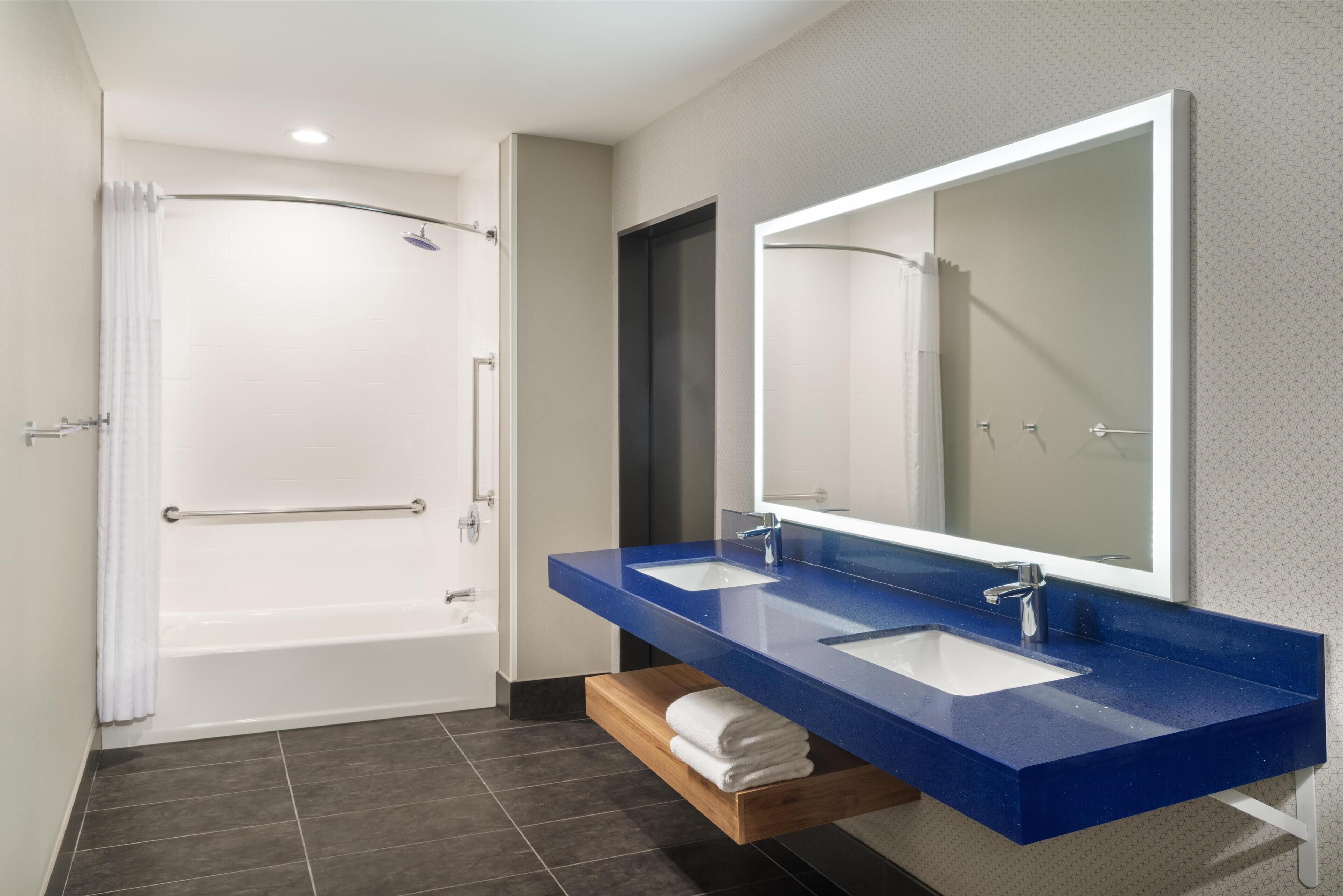 designer toiletries, hair dryer, towels, soap