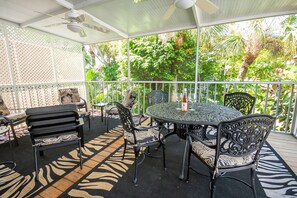 Outdoor dining - Beach Walk: North Beach Village, Pool, Quick Walk to Beach by Anna Maria Life Vacation Rentals (Holmes Beach)