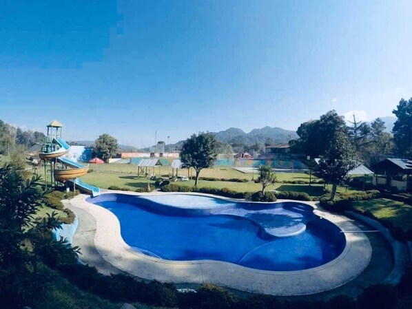 Outdoor pool, pool umbrellas, pool loungers