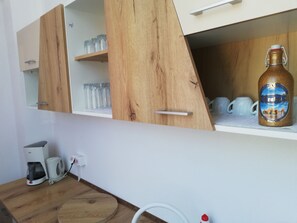 Full-sized fridge, microwave, coffee/tea maker, electric kettle