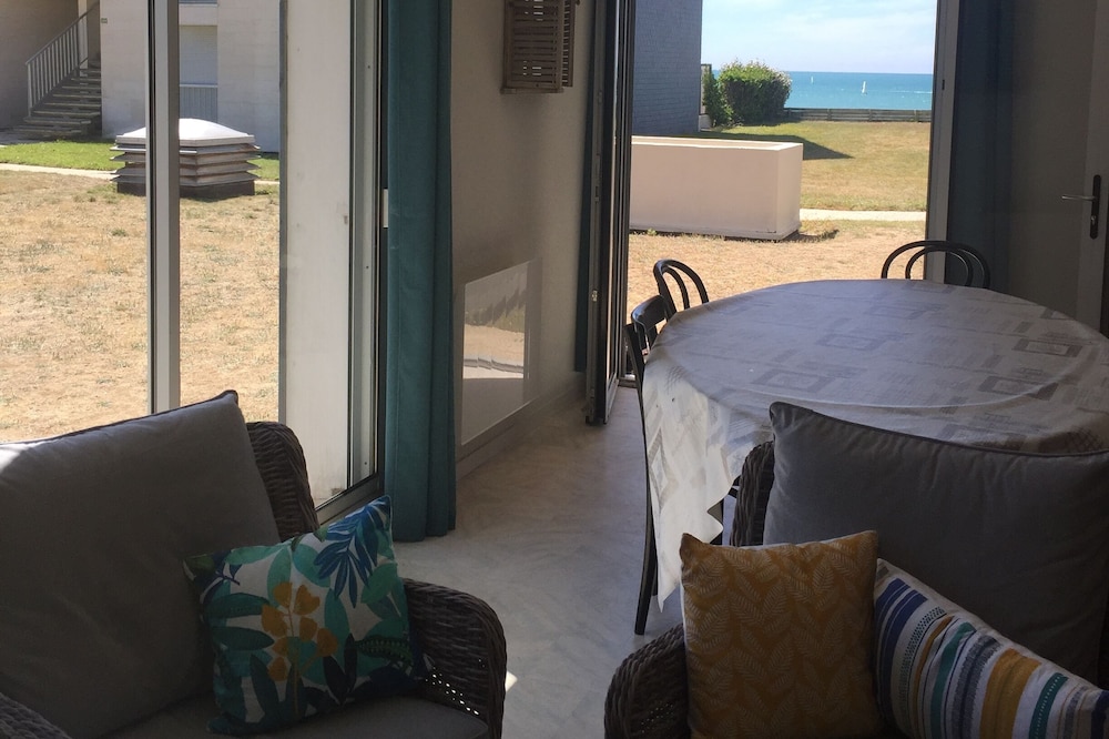 Ground floor at the edge of a sandy beach