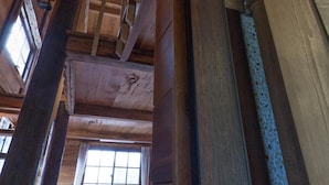 A wooden interior with exposed beams and a window. - Totally Habitat Homestay (Wujie)