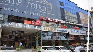 A hotel facade with "YALE TOUCHÉ" and "HOTEL PALAK" signs, indicating multiple establishments. - Hotel Palak Palace (Ahmedabad)