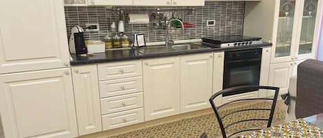 Microwave, coffee/tea maker, cookware/dishes/utensils