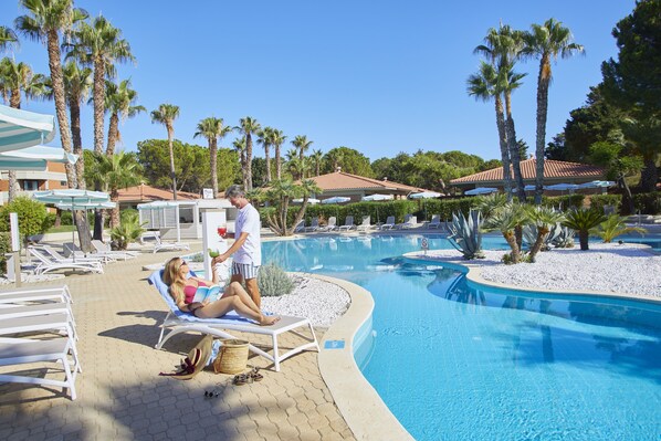 2 outdoor pools, open 10:00 AM to 7:00 PM, pool umbrellas, pool loungers