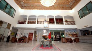 A spacious lobby with a high ceiling, ornate ceiling design, and a central decorative ship model. - Atlantique Panorama (Safi)