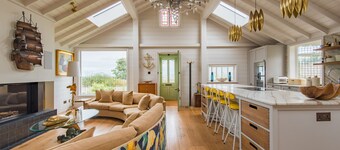 A luxurious waters-edge holiday home by the sea sleeping 11 right on the beach