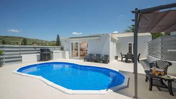 Outdoor pool, pool umbrellas, pool loungers