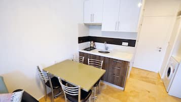 Apartment, 1 Bedroom, City View | Private kitchen | Full-size fridge, stovetop, electric kettle, cookware/dishes/utensils