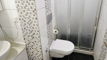 Apartment, 1 Bedroom, City View | Bathroom | Shower, rainfall showerhead, hair dryer, towels