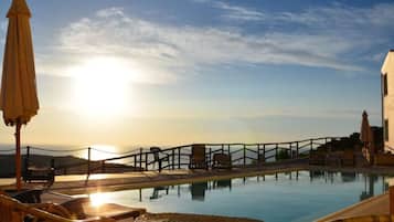 Seasonal outdoor pool, pool umbrellas, pool loungers