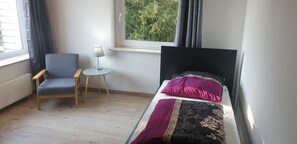 Desk, laptop workspace, free WiFi, bed sheets