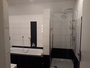 Bathtub, hair dryer, towels, soap
