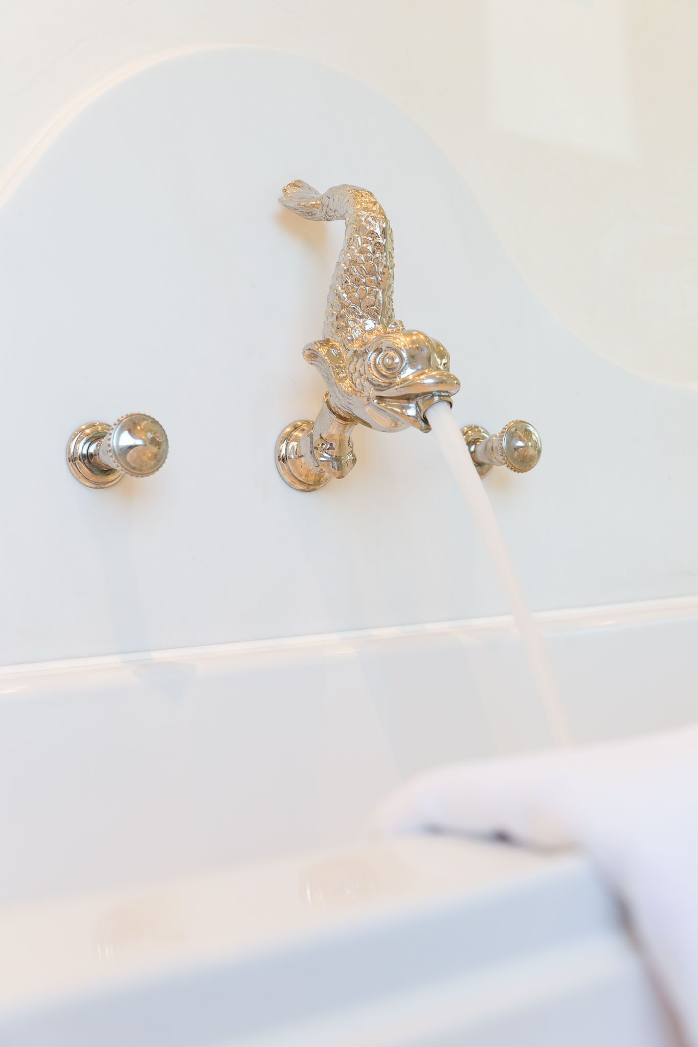 A bathtub with a faucet and a showerhead.