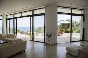 Royal Villa, 3 Bedrooms, Sea View | Living area | 42-inch Smart TV with satellite channels, TV, DVD player - The Cliff House (Carthage)