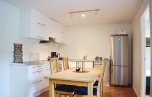 Fridge, stovetop, dishwasher, coffee/tea maker