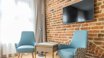 Superior Double Room (Deluxe) | Living area | LCD TV