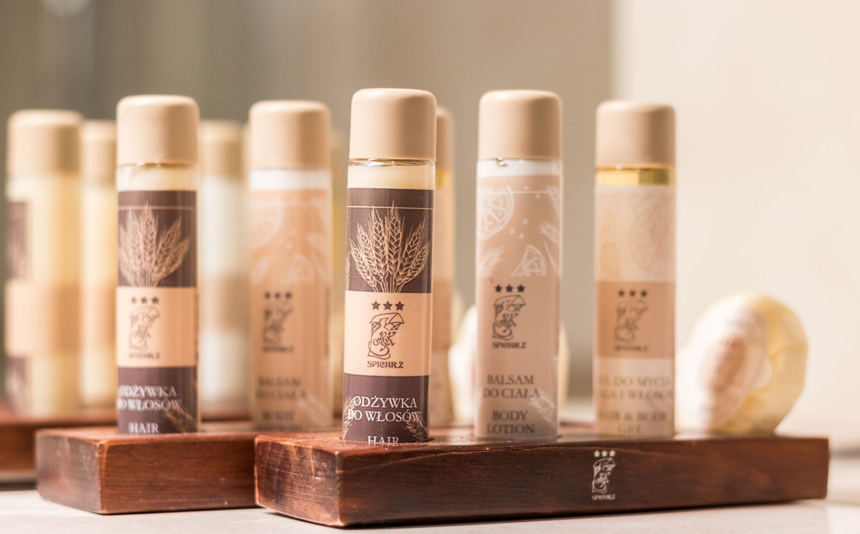 A row of hair care products on wooden stands.