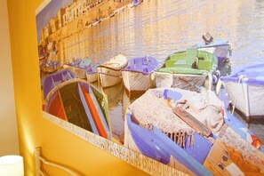 A photograph of boats docked at a waterfront. - Villetta 54 (Salve)